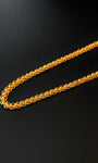 Gold chain on a black background