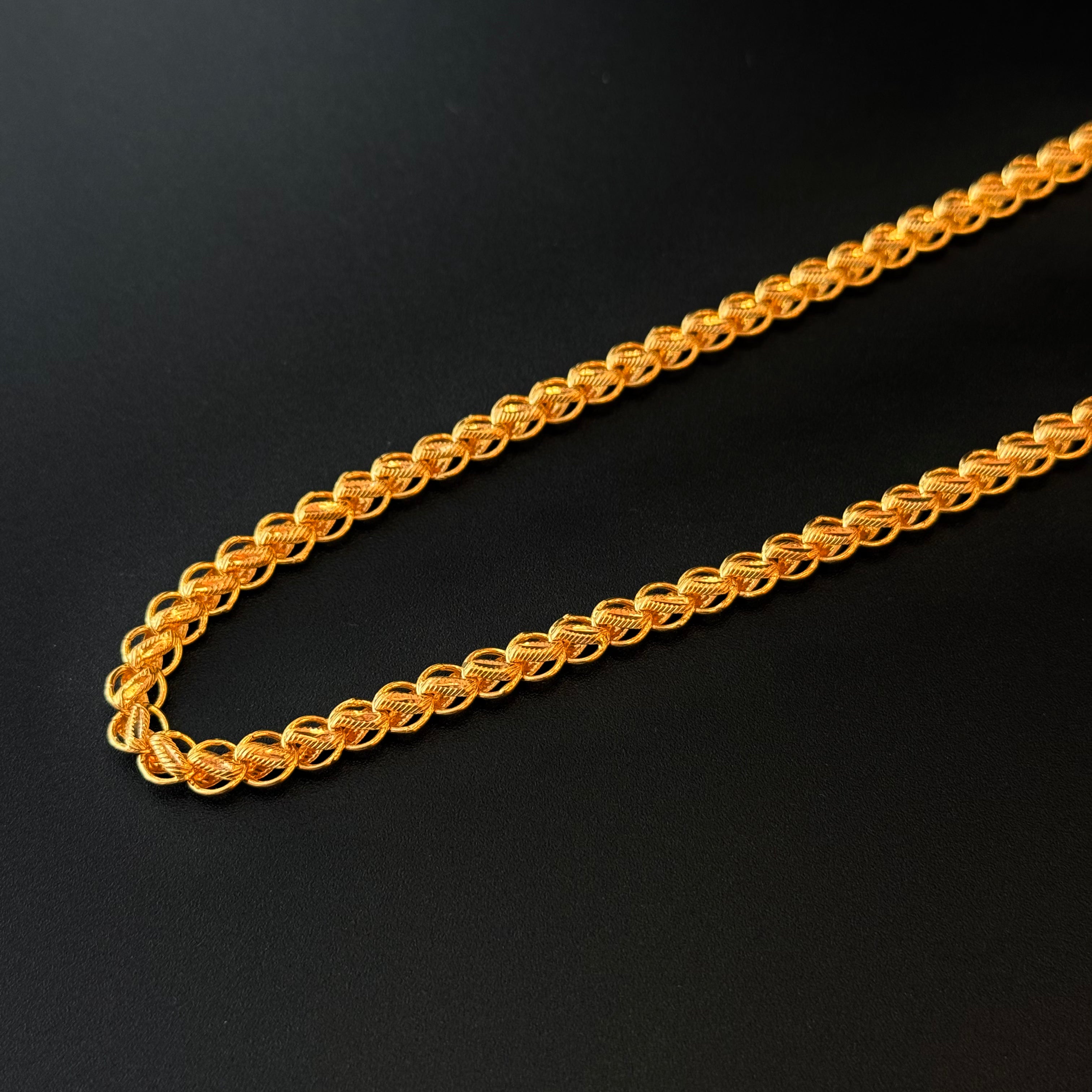 Gold chain on a black background