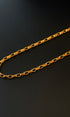 Gold chain on a black background