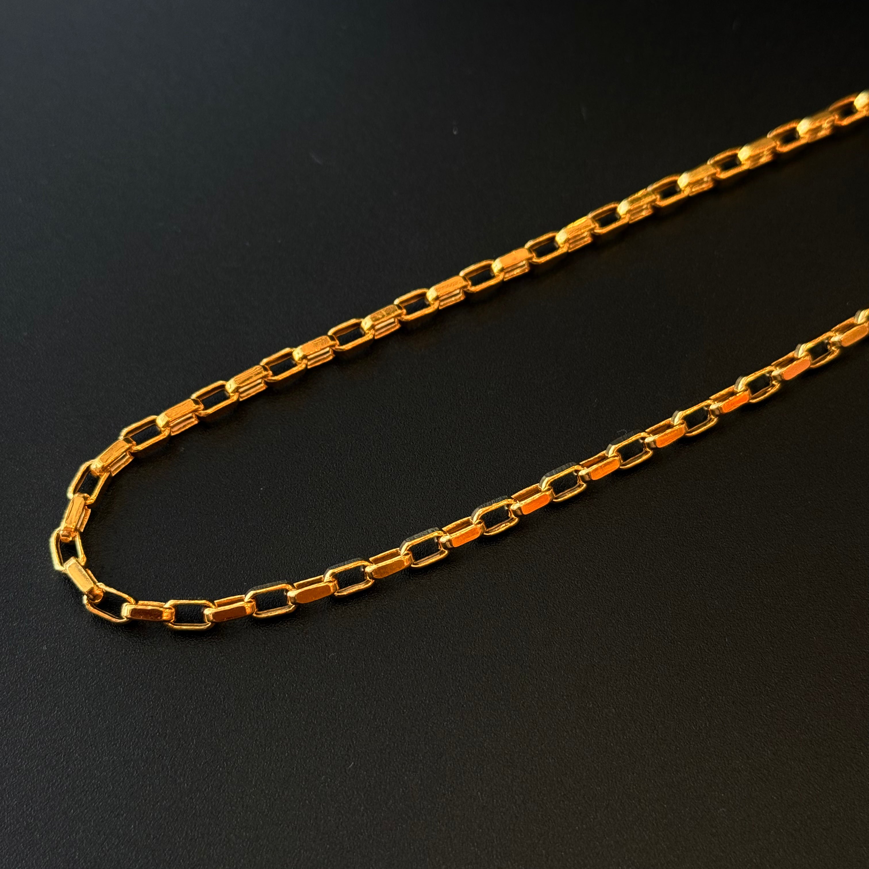 Gold chain on a black background