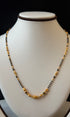 Necklace with black and gold beads 