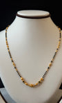 Necklace with black and gold beads 