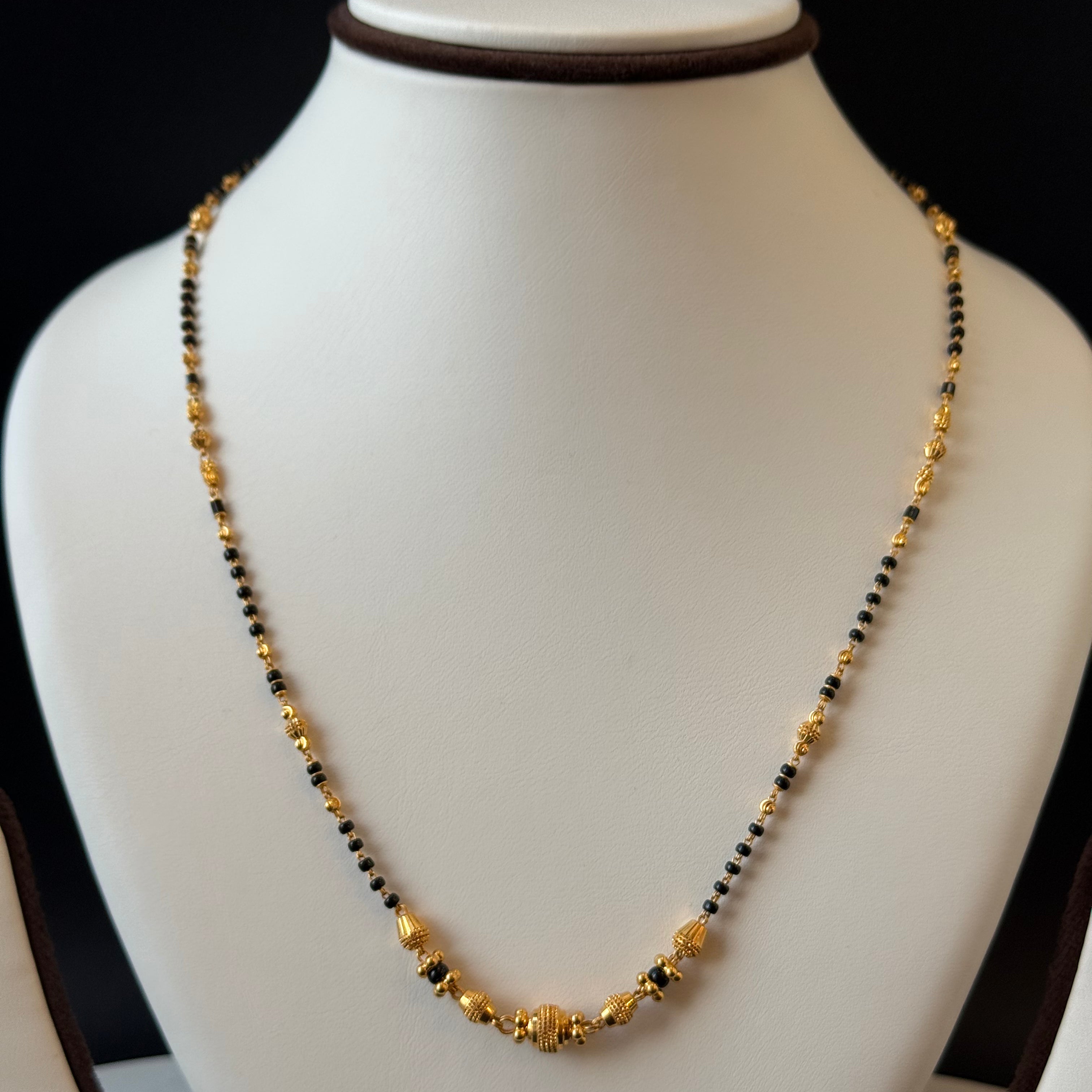 Necklace with black and gold beads 