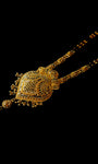 Gold necklace with black beads