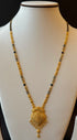 Gold necklace with black beads 